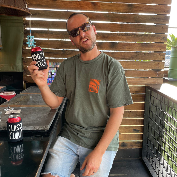 Man holding Boozy Bitch stubby holder