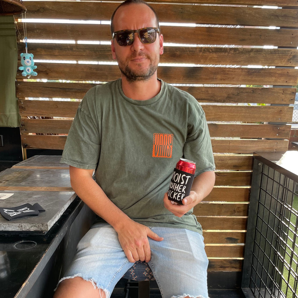 Man at bar with Moist Mother Fucker stubby holder